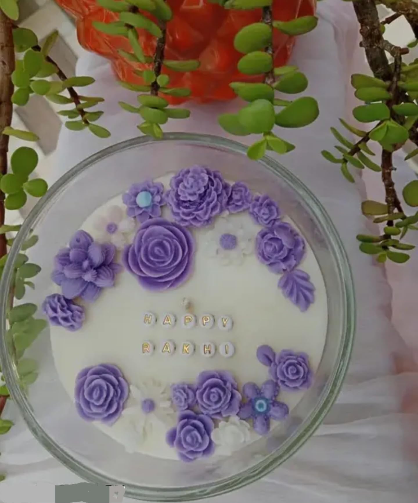 Elegant Round Birthday Cake with Purple Rose Decorations, White Fondant, Glass Display Plate
