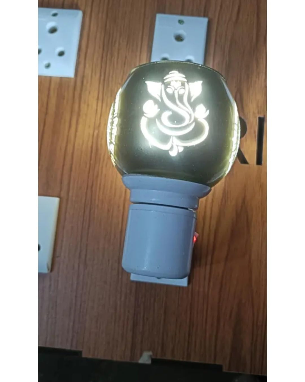 Electric Aroma Oil Diffuser Lamp with Ganesha and Om Design, Plug-in Night Light, Warm Golden Glow