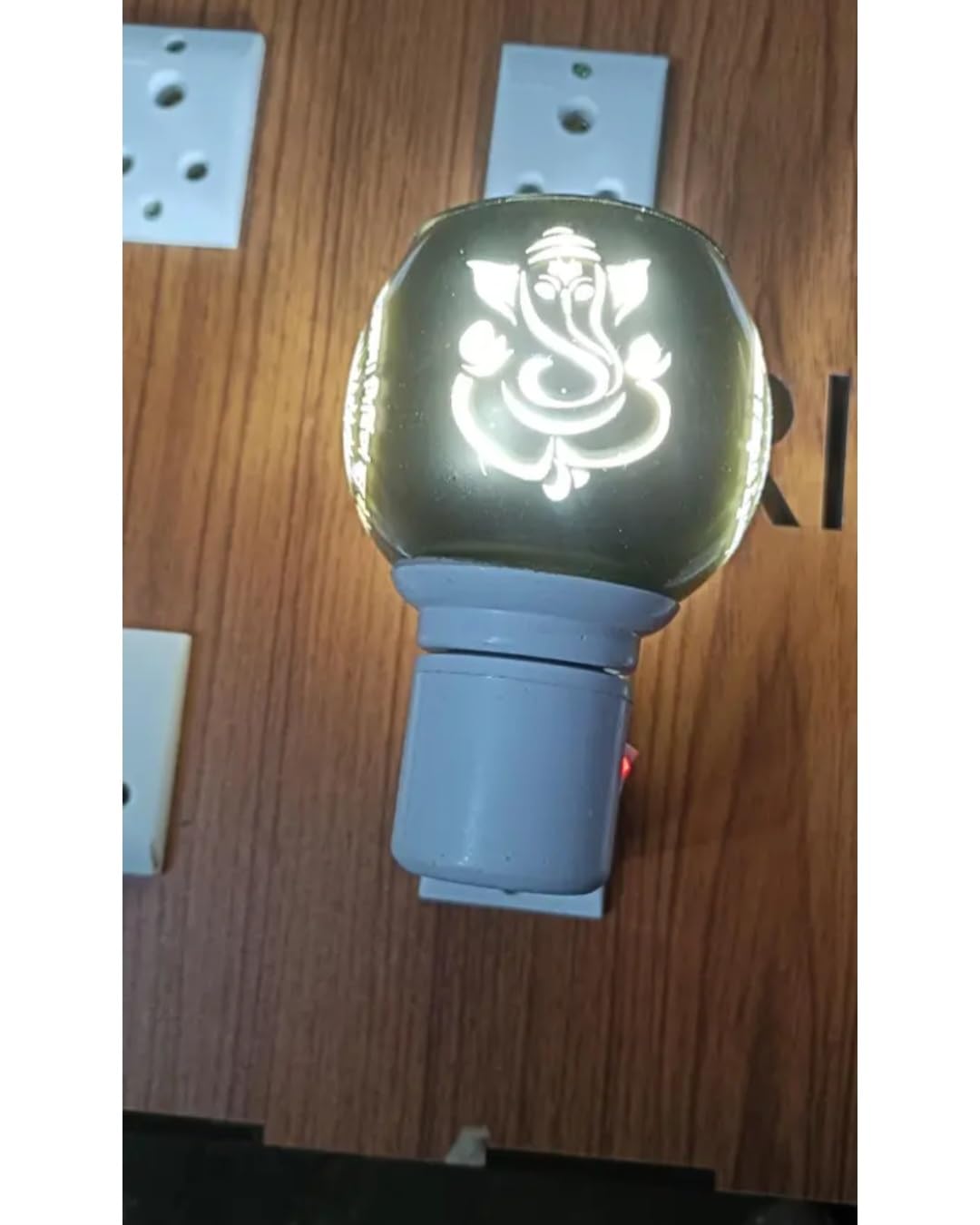 Electric Aroma Oil Diffuser Lamp with Ganesha and Om Design, Plug-in Night Light, Warm Golden Glow