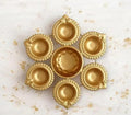 Decorative Gold Diya Set, Traditional Brass Oil Lamp Holders for Puja, Ornate Scalloped Design, 8 Connected Diyas