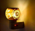 Electric Aroma Oil Diffuser Lamp with Ganesha and Om Design, Plug-in Night Light, Warm Golden Glow